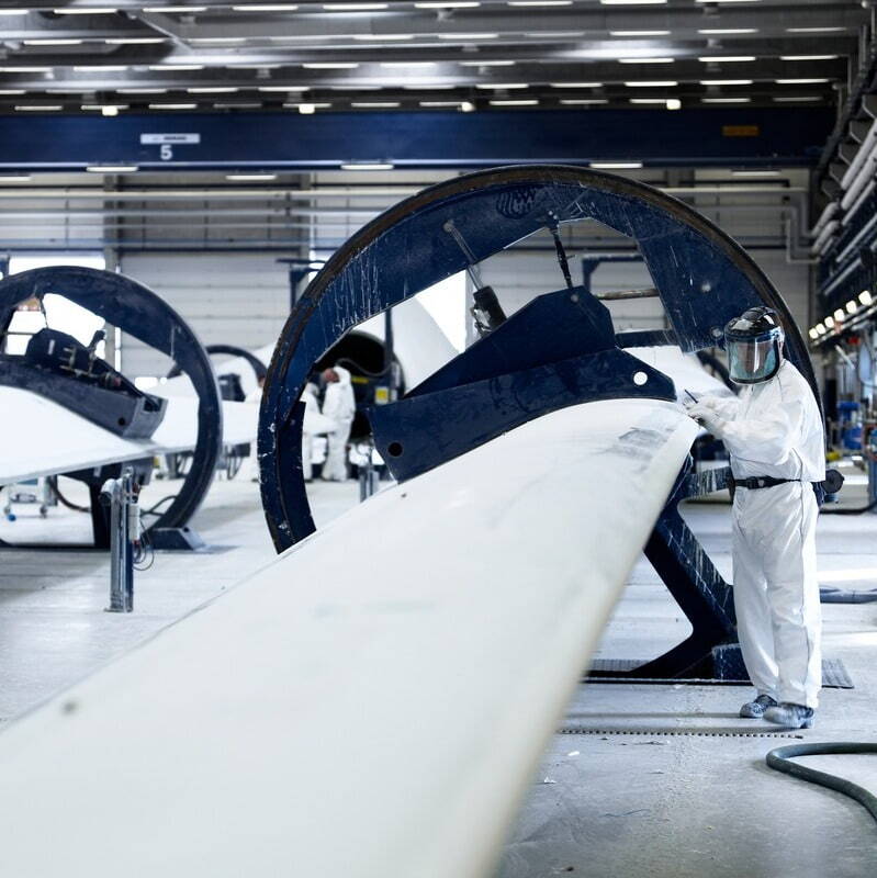 Vestas Wind Turbine installation in a green open field with other wind turbines